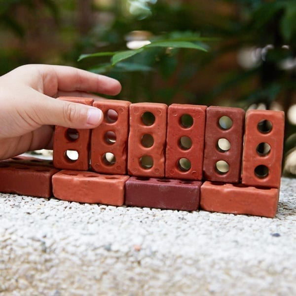 Image of a build using Guidecraft Little Bricks outdoors on pavement