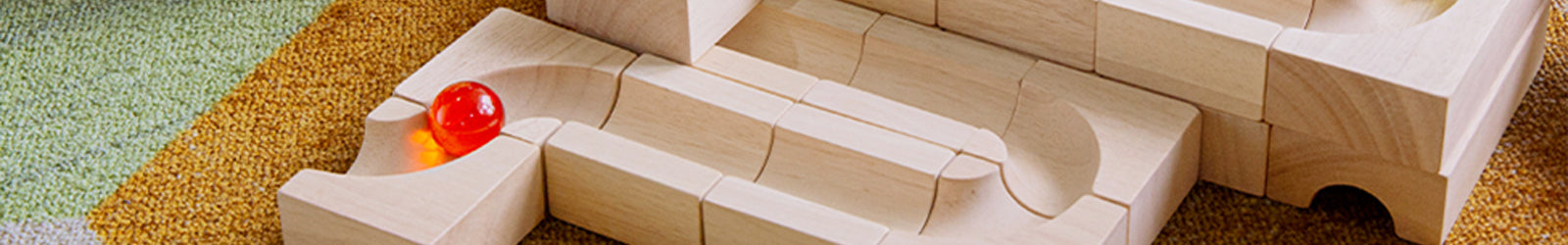 A marble going down a wooden track