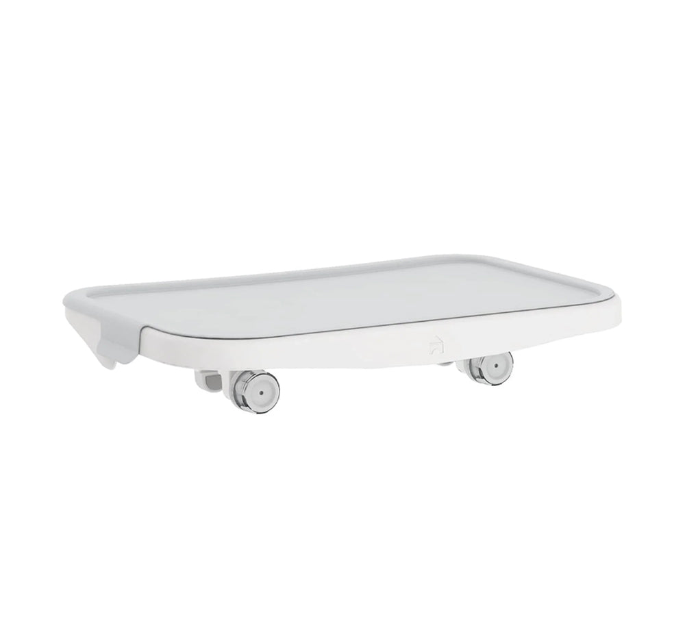 A white rectangular serving tray with rounded edges, featuring small wheels underneath for easy movement.