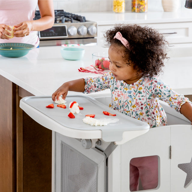 Child playing in Kitchen Helper.