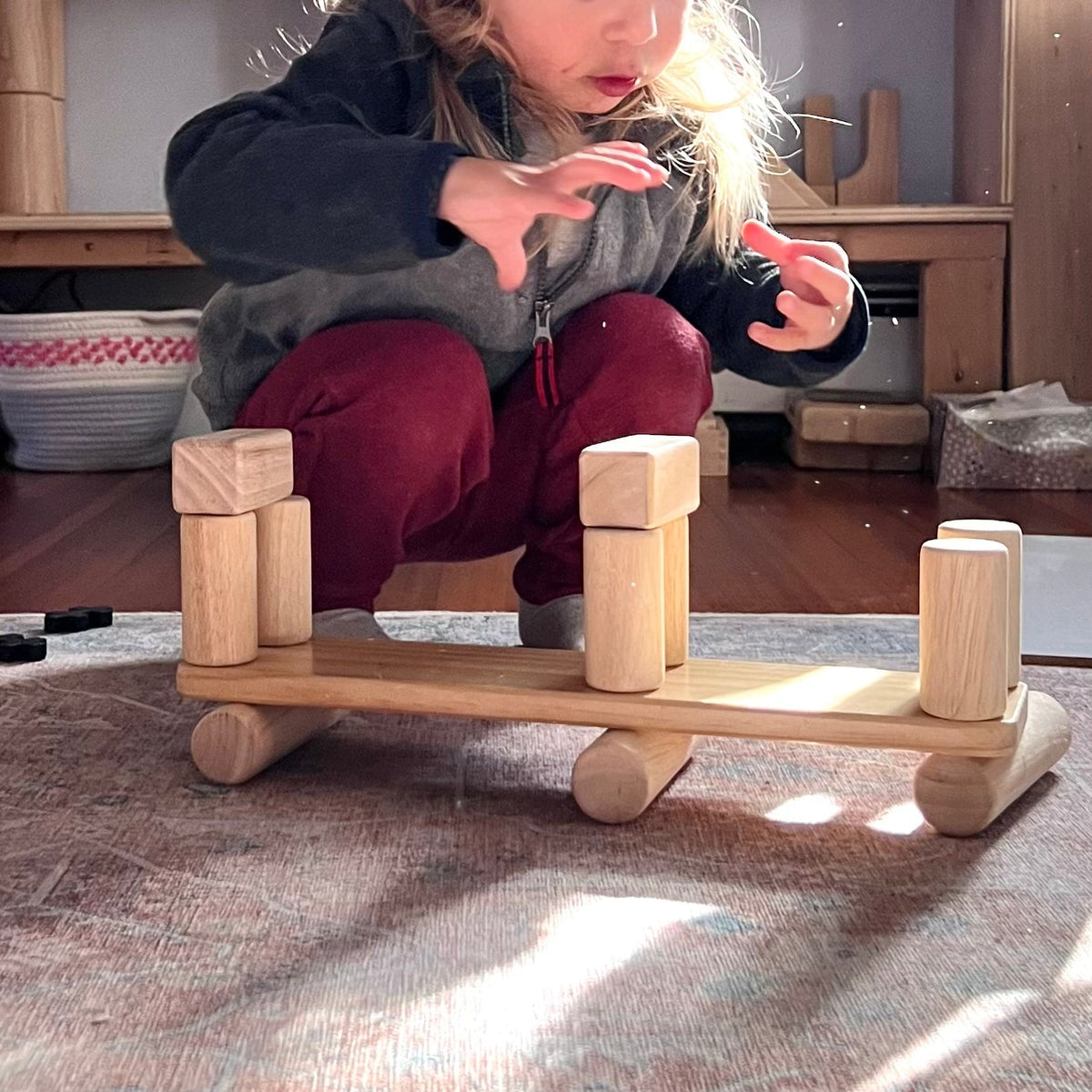 Young boy building using wooden Unit Blocks
