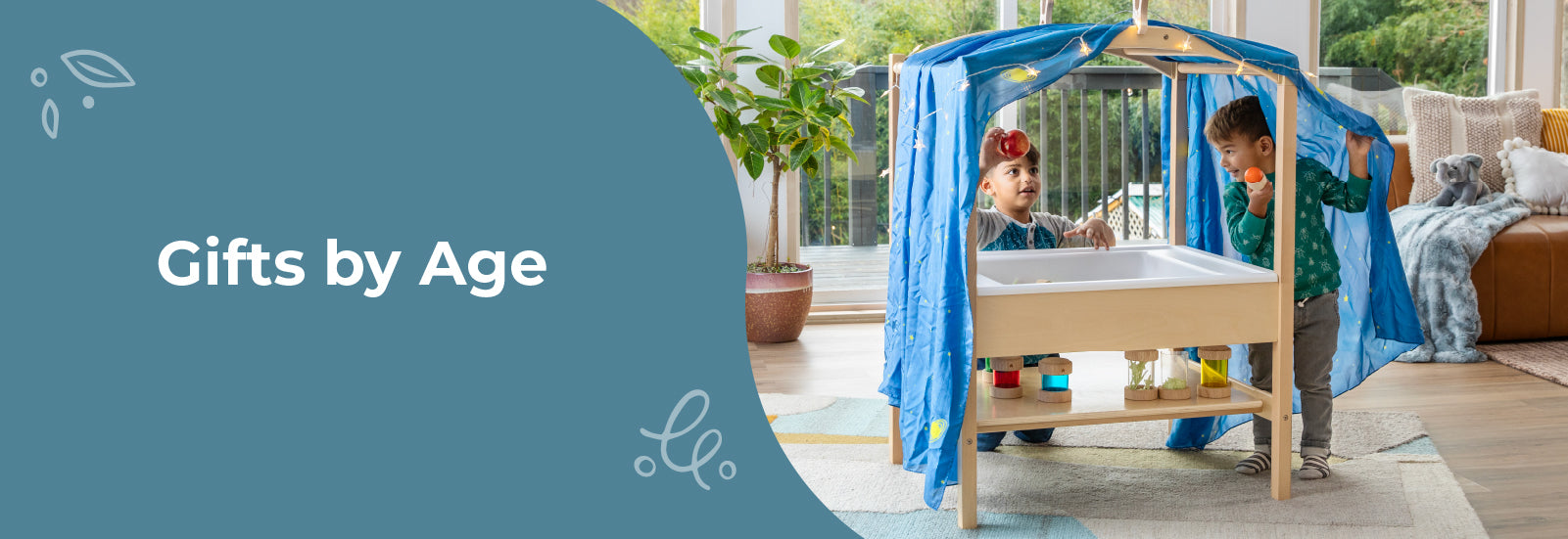 2 young boys playing with the sensory table