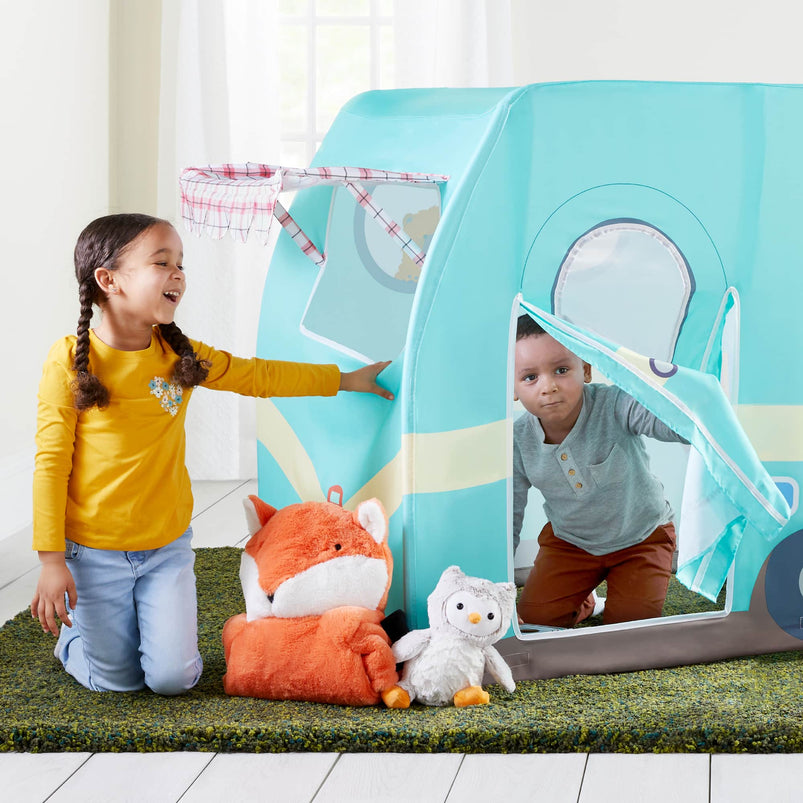 2 young children playing with a Martha Stewart camper play tent