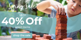 Spring sale advertisement with a child playing with building blocks.