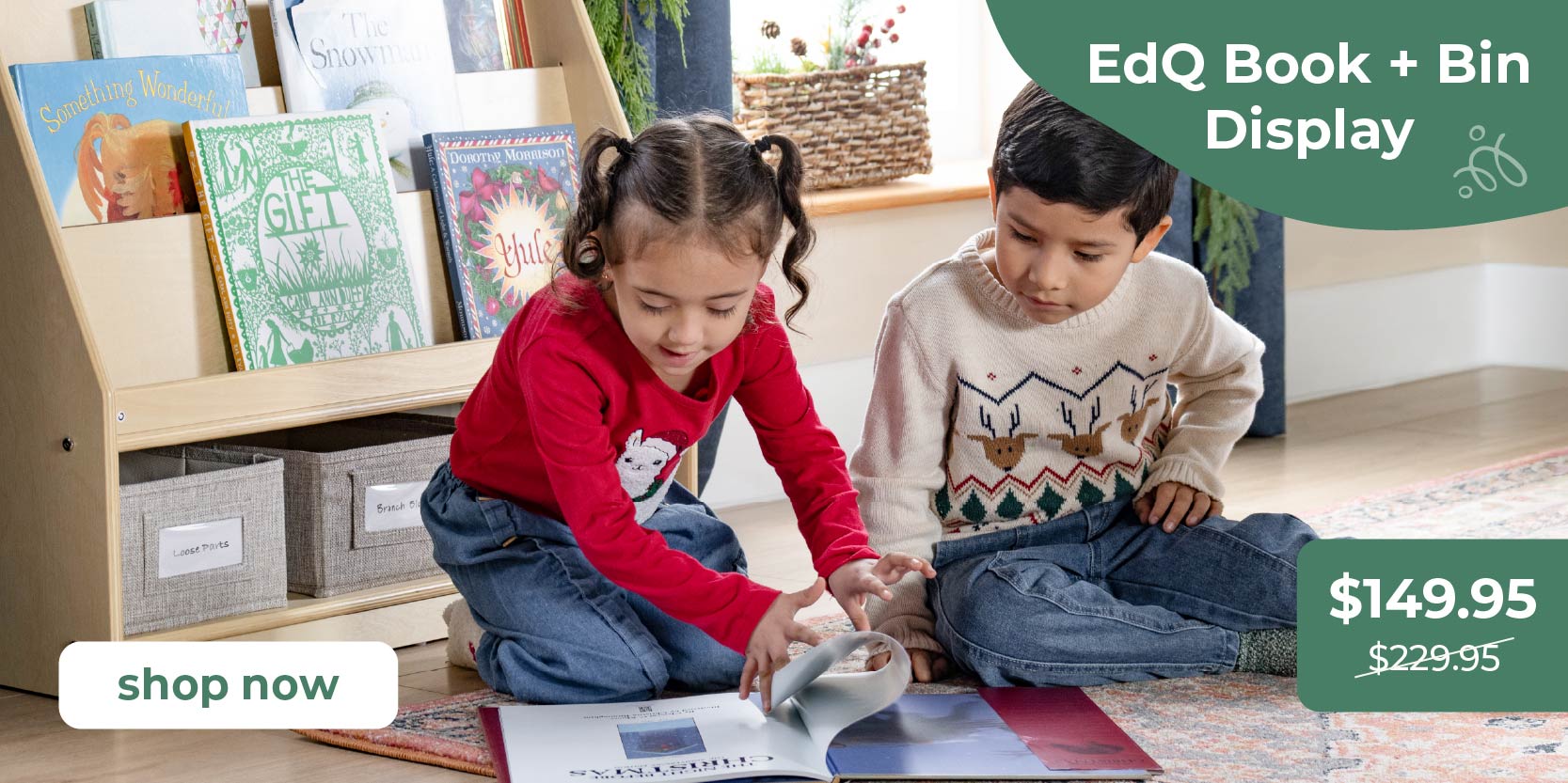 Two children are reading a book sitting on the floor in front of an EdQ Book + Bin Display. Promotional text = Book and Bin Display, regular price $229.95, sale price $149.95. Click to shop now.