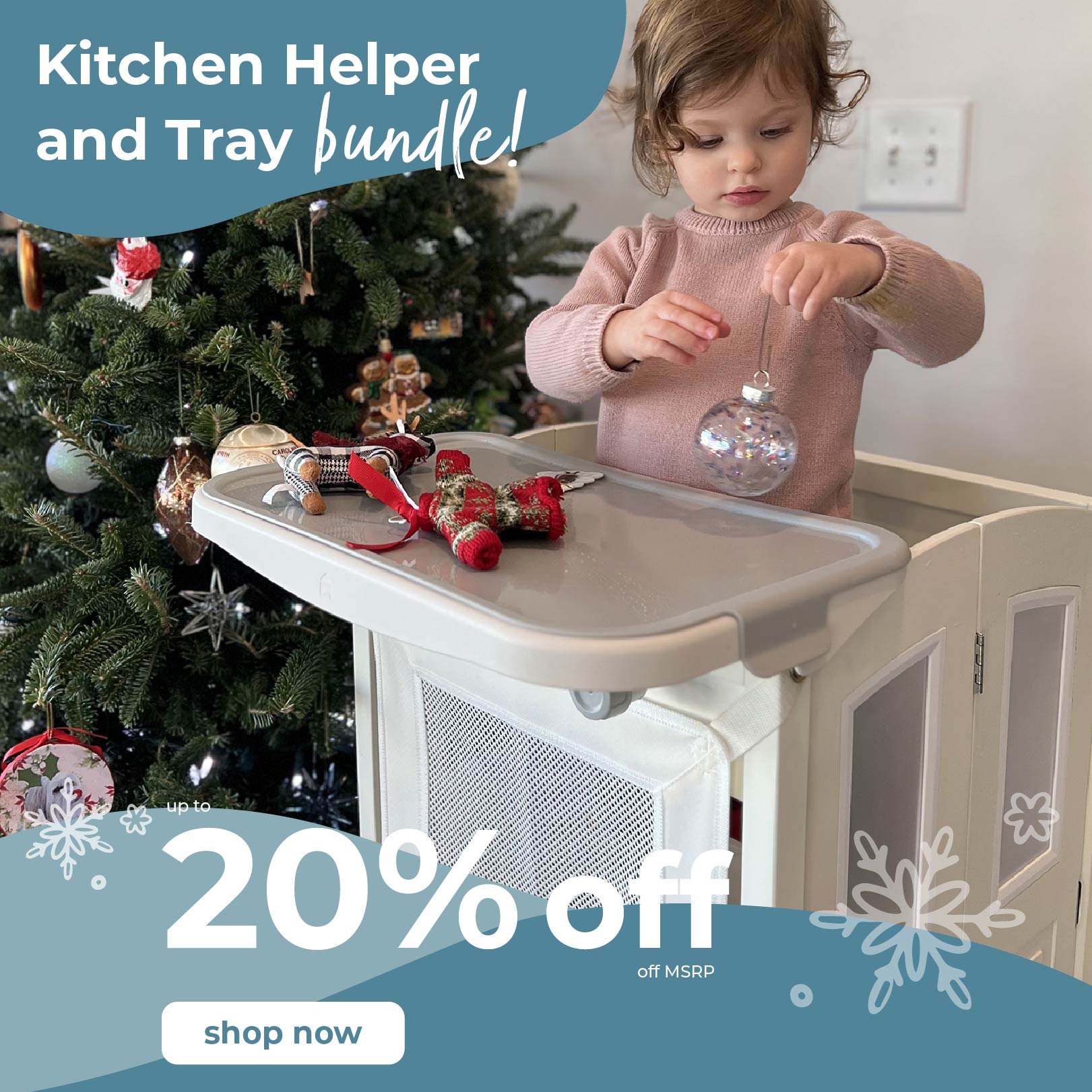 Child using a Kitchen Helper Bundle with tray hanging Christmas decorations, promotional text overlay. Up to 20% off MRP. Click to shop Kitchen Helper bundles.
