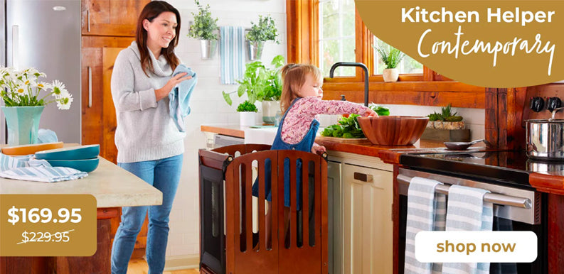 Woman and child in a kitchen, child is in a toddler tower, Kitchen Helper, promotional text for 'Kitchen Helper Contemporary' product. Sale price $169.95 MSRP $229.95. Click to shop now.