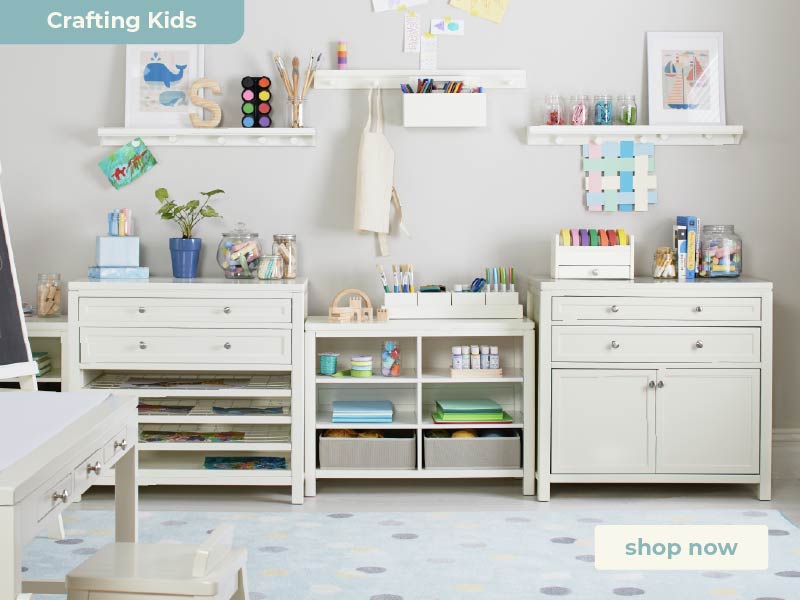 Children's playroom with white art furniture, toys, and decor. Click to shop the Martha Stewart Crafting Kids' Collection.
