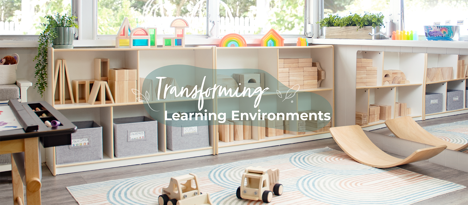 Children's playroom with educational toys and furniture, featuring the text 'Transforming Learning Environments'.