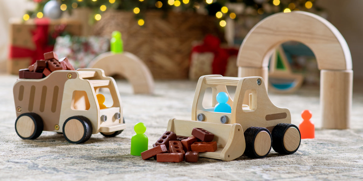 Wooden toy cars with blocks on a festive background