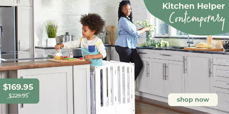 Woman and child in a kitchen. child is in the 'Kitchen Helper Contemporary' product. Click to shop the kitchen helper contemporary toddler tower