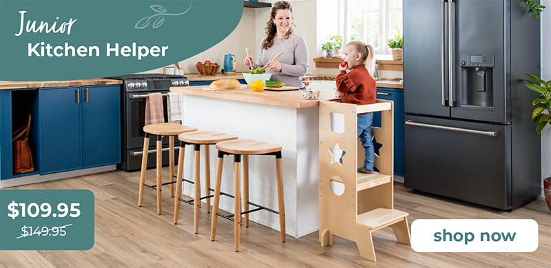 Woman and child in a kitchen with a Junior Kitchen Helper Classic style product displayed.