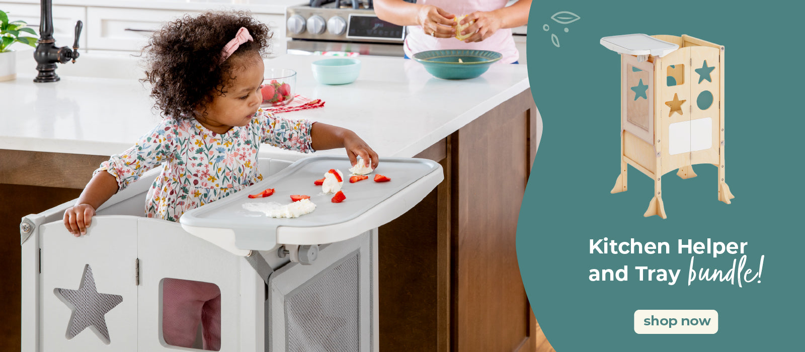 Child in a kitchen helper and tray bundle in a kitchen. Click to shop kitchen helper bundles.