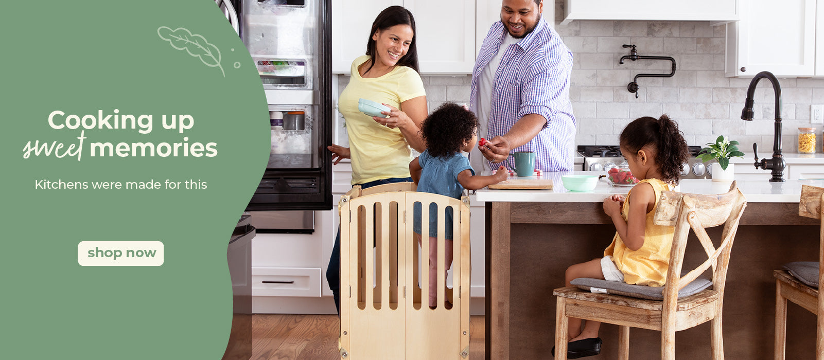 Happy family in the kitchen, youngest daughter in the kitchen helper toddler tower. Click to shop all kitchen helpers.