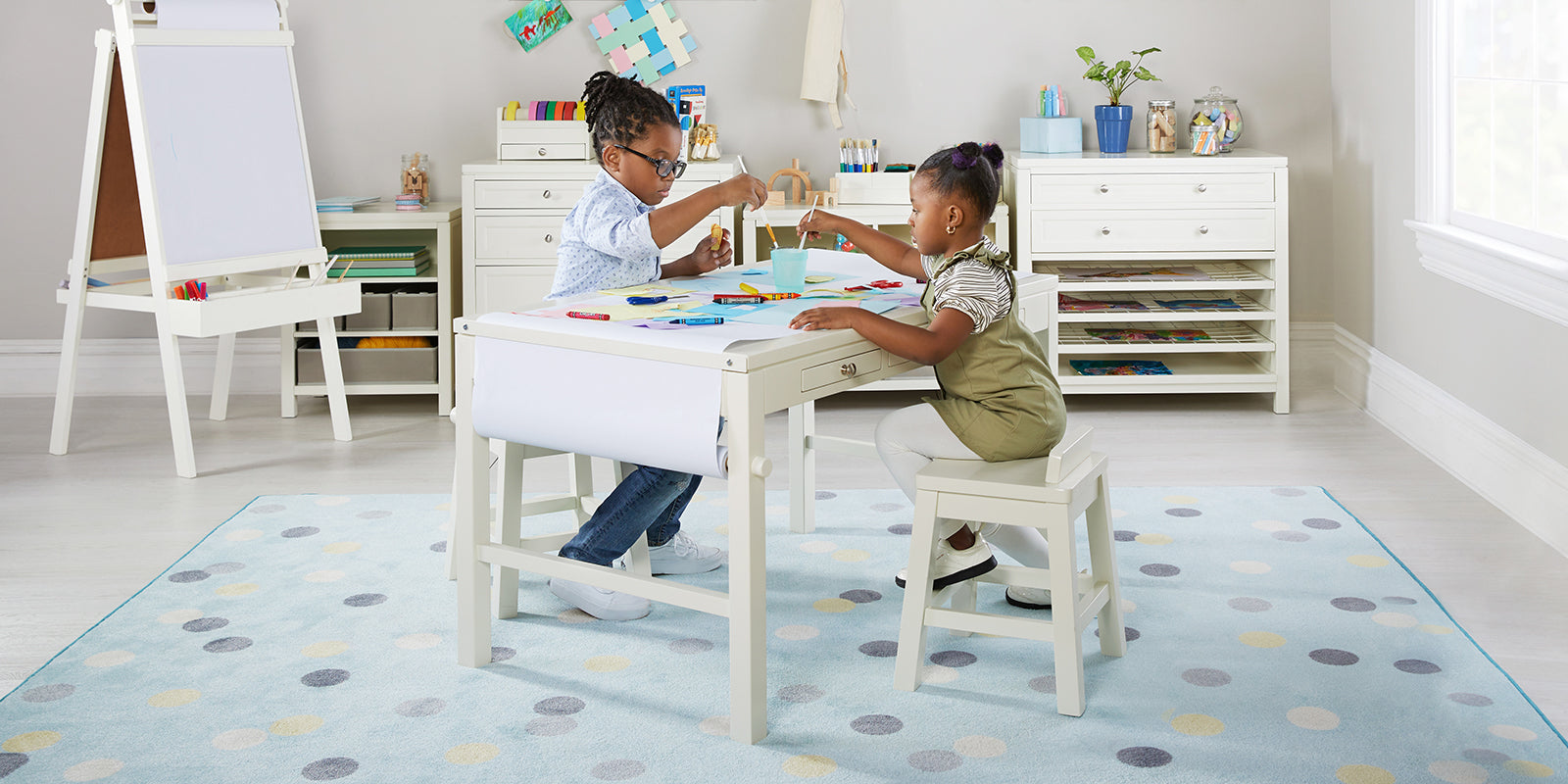 Martha Stewart Crafting Kids Art Table two kids sitting at the table creating art