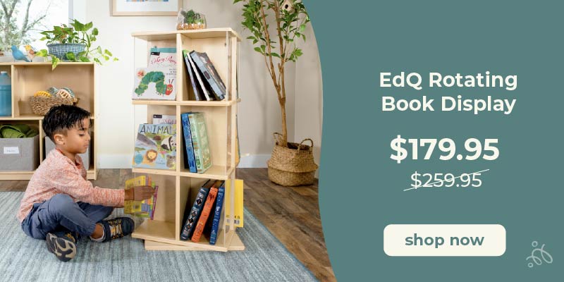 Child interacting with an EdQ Rotating Book Display in a home setting. Click to shop the Rotating Book Display at $179.95