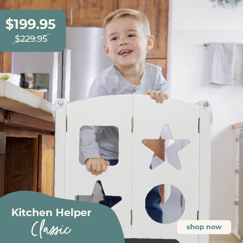 Child playing with a kitchen helper product in a home setting. Click to shop Kitchen Helper Classic, sale price $199.95