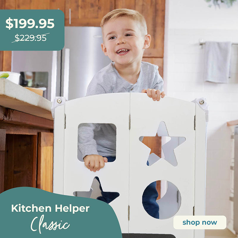 Child playing with a kitchen helper product in a home setting. Click to shop Kitchen Helper Classic, sale price $199.95