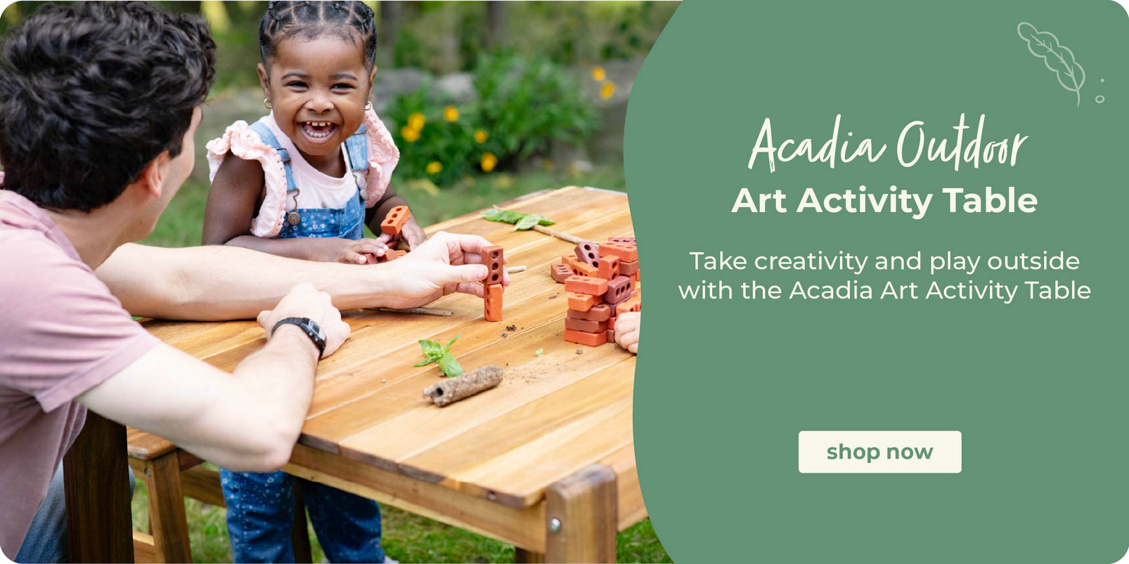 Person and child at a wooden table outdoors with Acadia Outdoor product promotion. Click to shop the Acadia Art Acivity Table