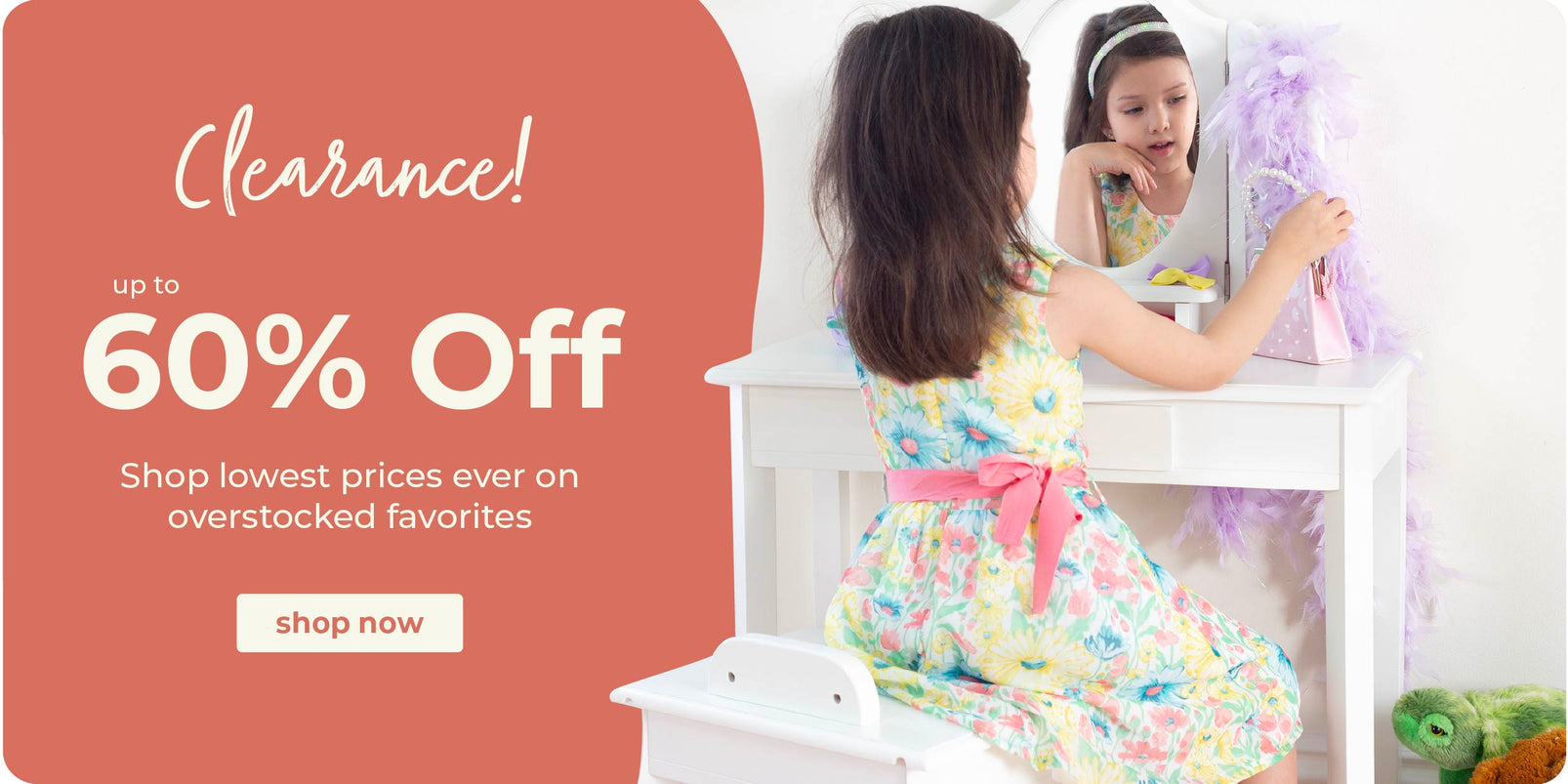 Girl sitting at a white kids' vanity. Click to shop all clearance items