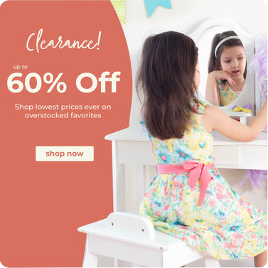 Girl sitting at a white kids' vanity. Click to shop all clearance items
