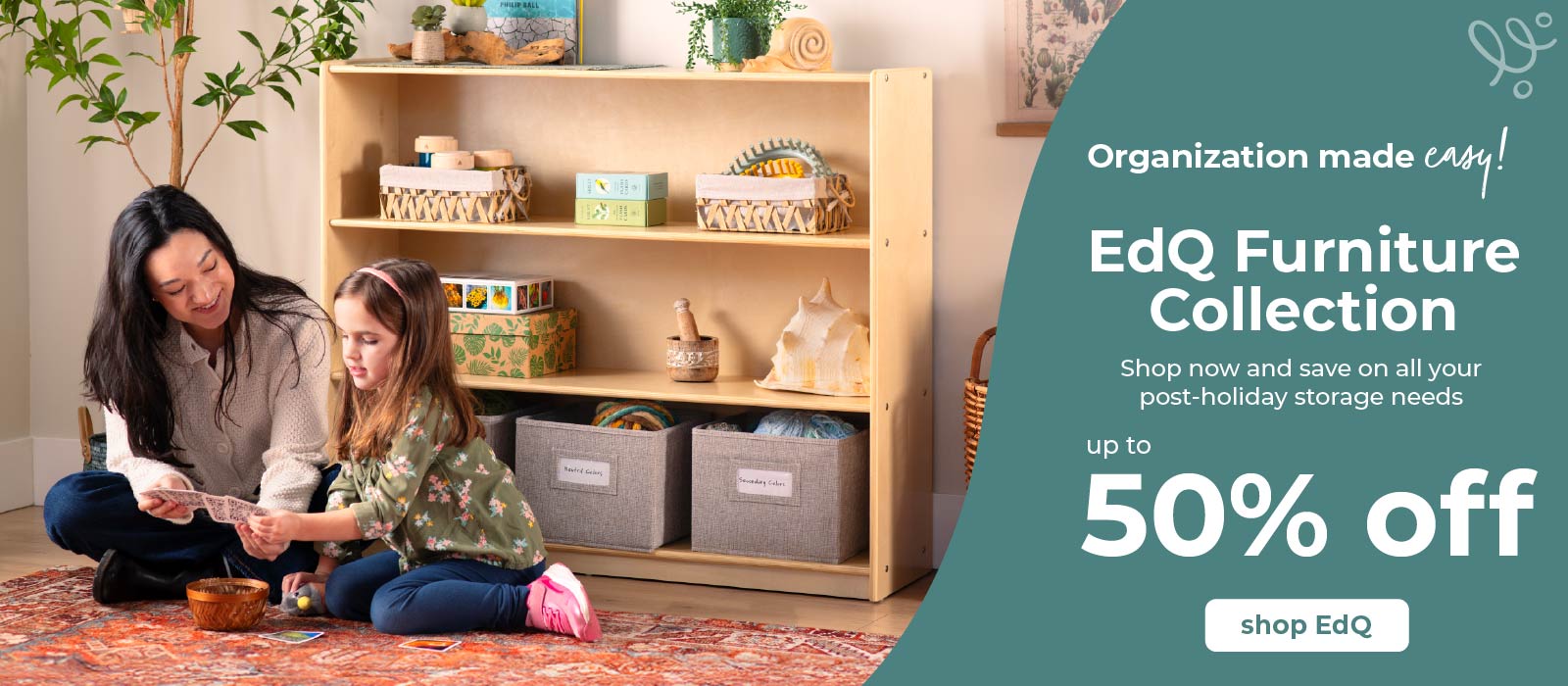 Woman and child sitting on the floor in front of a wooden bookshelf with storage bins, promotional banner for EdQ Furniture Collection. Click to shop the collection up to 50 percent off.