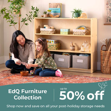 Woman and child sitting on the floor in front of a wooden bookshelf with storage bins, promotional banner for EdQ Furniture Collection. Click to shop the collection up to 50 percent off.
