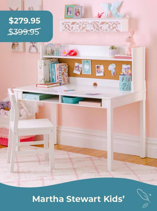 Children's desk and chair set with pink walls and decorative elements. Click to shop sale price of $279.95 down from $399.95