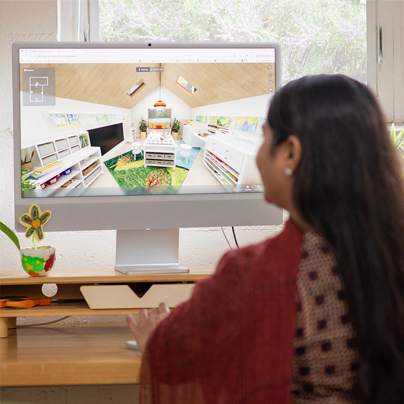 Woman at computer designing an educational learning space