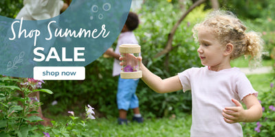 Child holding a product with 'Shop Summer Sale' text overlay in an outdoor setting