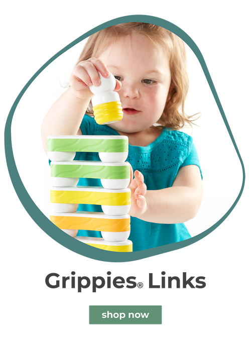 Toddler girl playing with GRippies Links magnetic toy