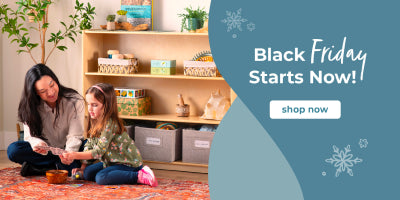 Woman and child sitting on a rug in a room with shelves displaying various items, with a promotional banner for Black Friday.