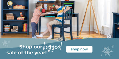 Two children at a desk with a bookshelf in the background, promotional banner at the bottom.