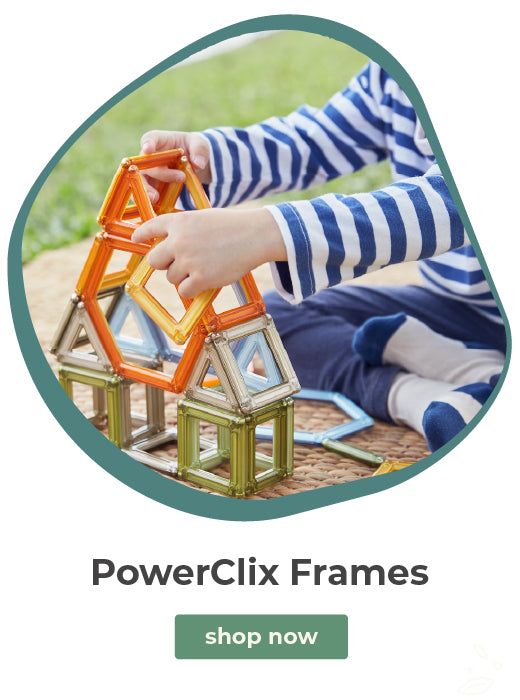 A promotional graphic for PowerClix Frames showing a child in a blue-and-white striped shirt building a house with colorful magnetic tiles. The image is framed with a teal border on a white background, with the text 'PowerClix Frames' and a green 'shop now' button below.